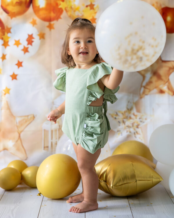 mace and co kids clothing dubai, romper with bow back in mint green color in linen fabric material, for girls ages infant, toddler up to three years old, perfect for birthday parties, special occasions and formal wear.