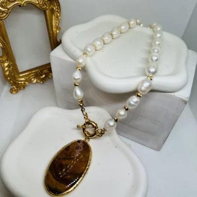 Maroon agate Stone on a Fresh water Pearl necklace with. A front Clip 18 k gold plated