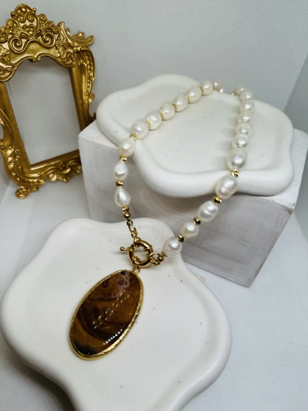 Maroon agate Stone on a Fresh water Pearl necklace with. A front Clip 18 k gold plated